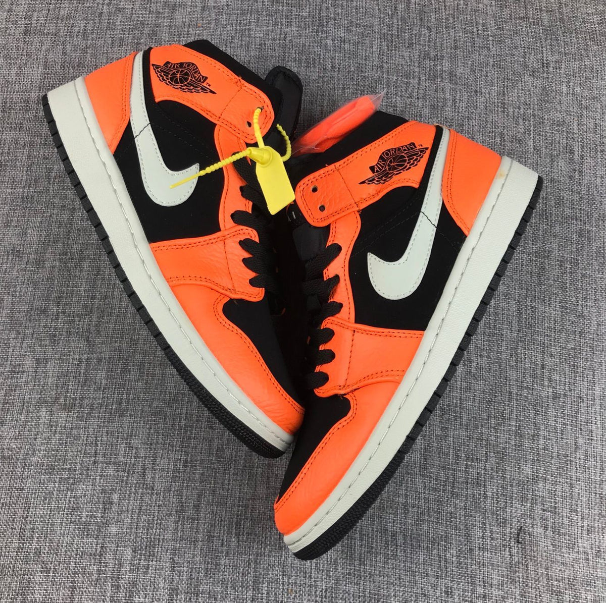 Air Jordan 1 Mid Shattered Backboard Sneakers, in Black and Orange - product image from the listing.