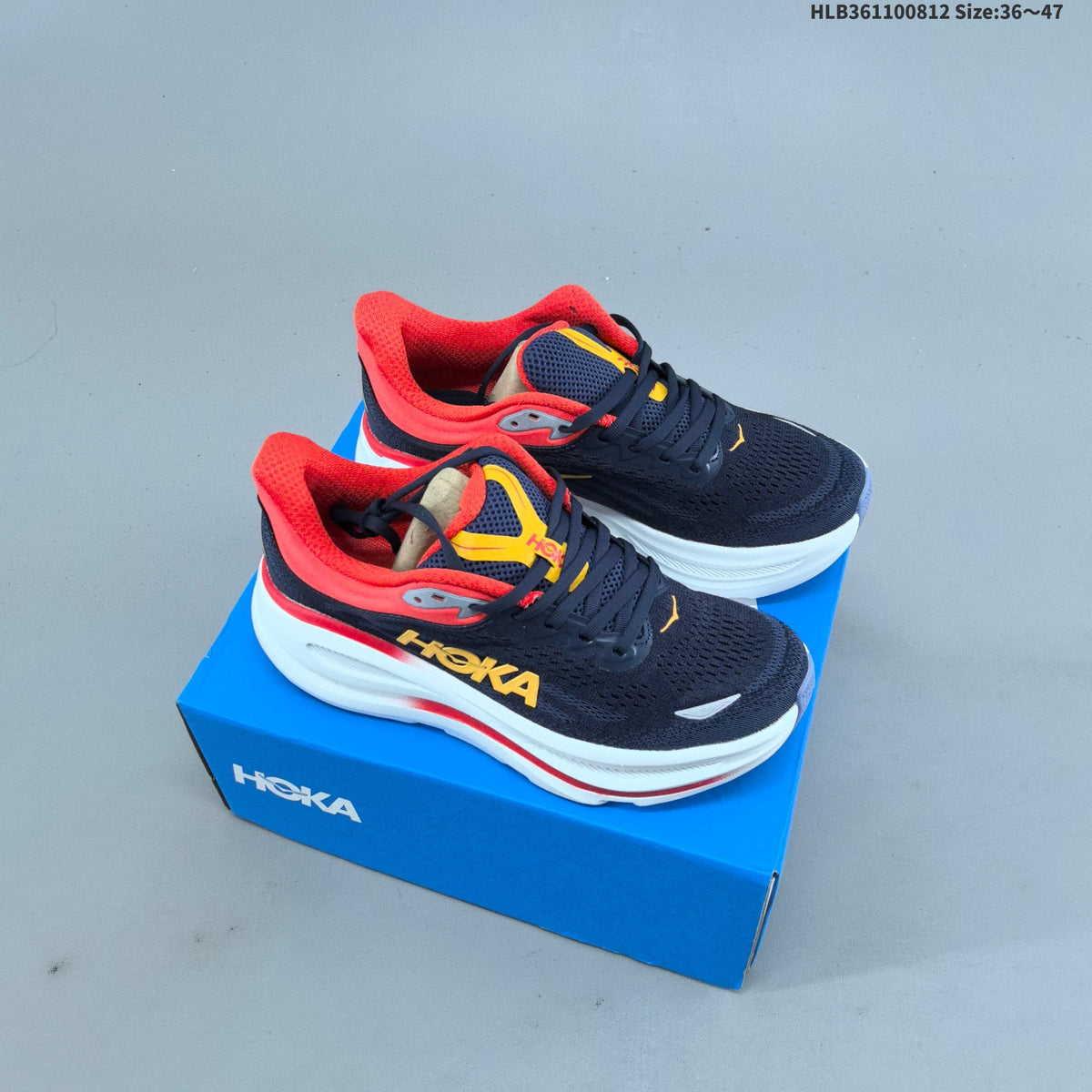 HOKA Bondi 9 Running Shoes in Navy, in Red and Yellow - product image from the listing.
