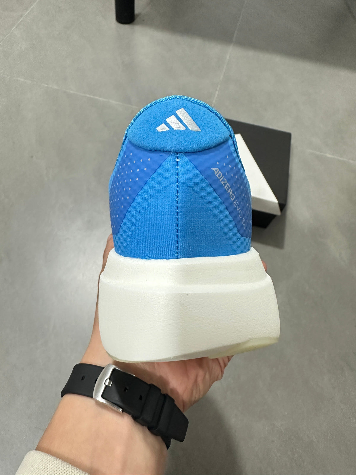 adidas Adizero EVO SL Running Shoes in White Blue JR2027 - product image from the listing.