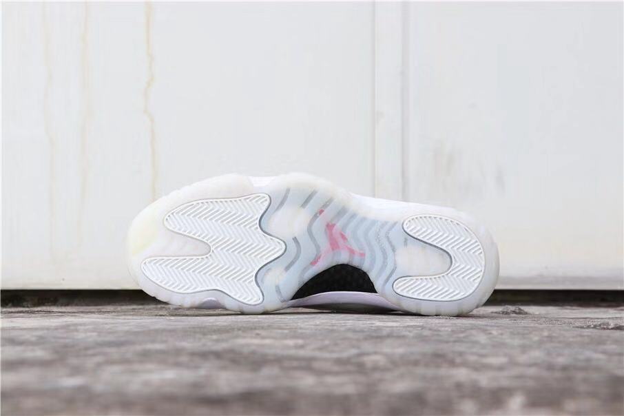 Air Jordan 11 Platinum Tint White High-Top Sneakers - product image from the listing.