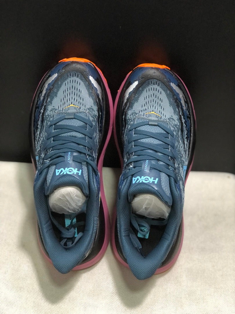 Blue and Orange HOKA Stinson 7 Trail Running Shoes - product image from the listing.