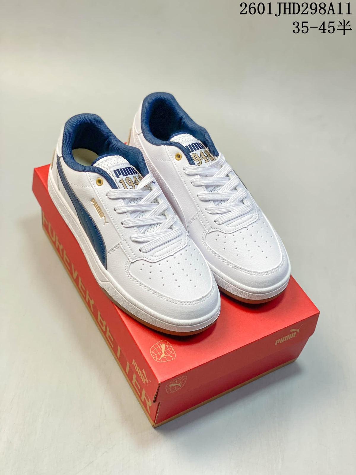 Puma Caven 2.0 Low-Top Sneakers in Red and White/Navy - product image from the listing.