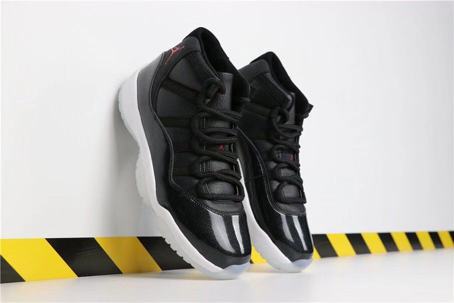 Air Jordan 11 Retro 72-10 High-Top Sneakers in Black and White - product image from the listing.