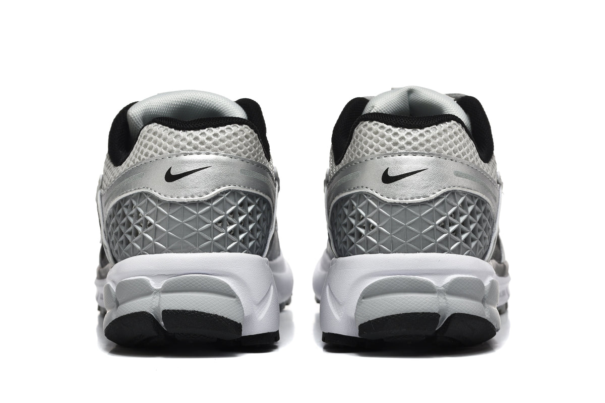 Nike Silver and Black Mesh Trainers - product image from the listing.