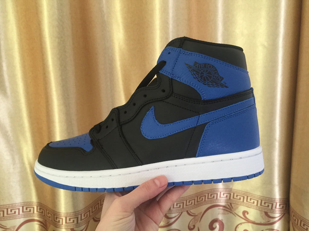 Jordan 1 High Sneakers in Black and Royal Blue - product image from the listing.