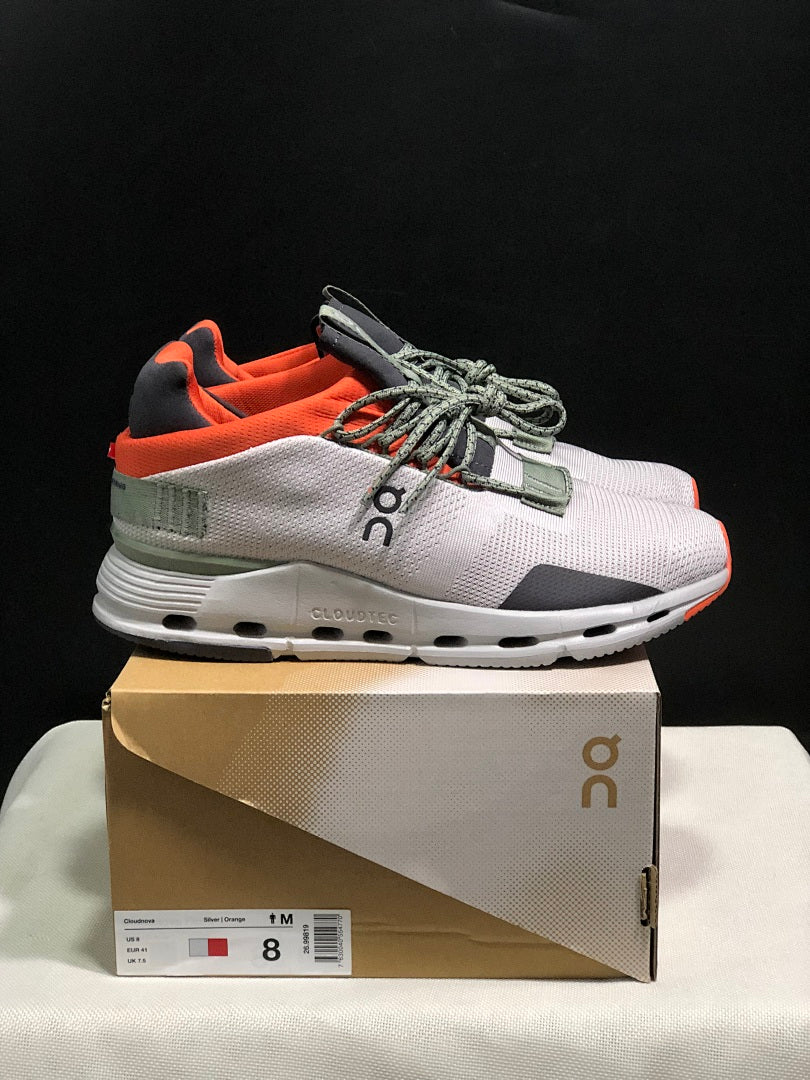 On Cloudnova 1 Sneakers, in Silver and Orange - product image from the listing.