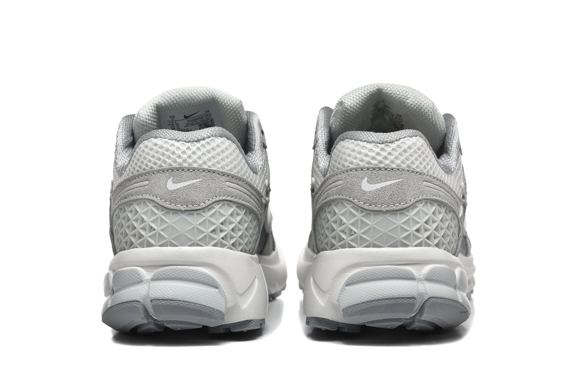 Grey and White Nike Vomero 5 Sneakers - product image from the listing.