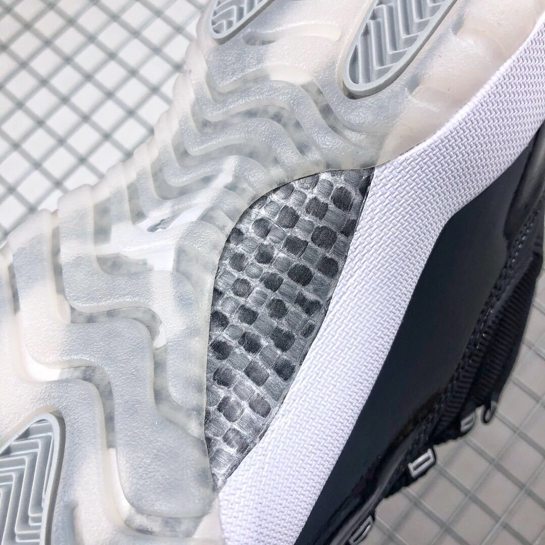 Air Jordan 11 Silver Eyelets Black White Sneakers - product image from the listing.
