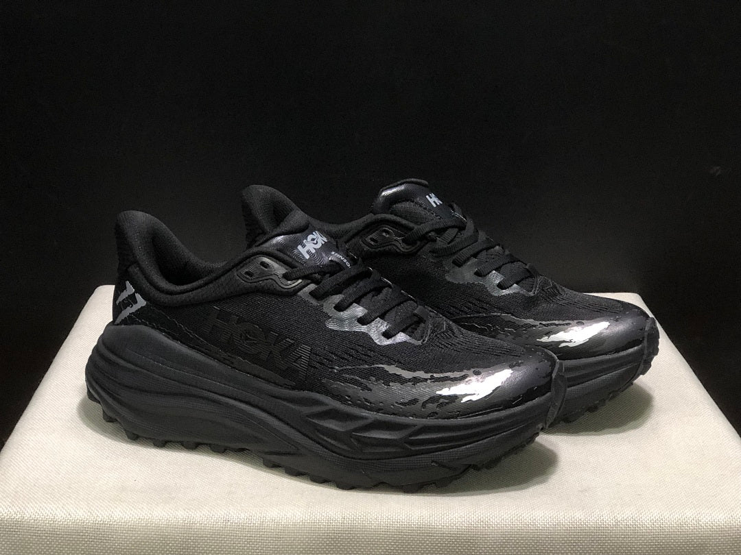 HOKA Stinson 7 Black Trail Trainers - product image from the listing.