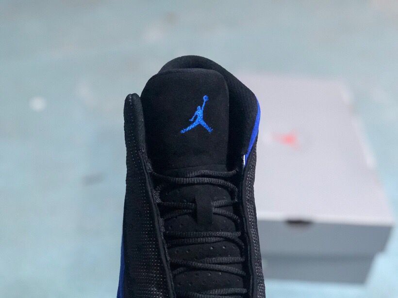 Jordan 13 Retro Sneakers Black/Royal in Blue - product image from the listing.