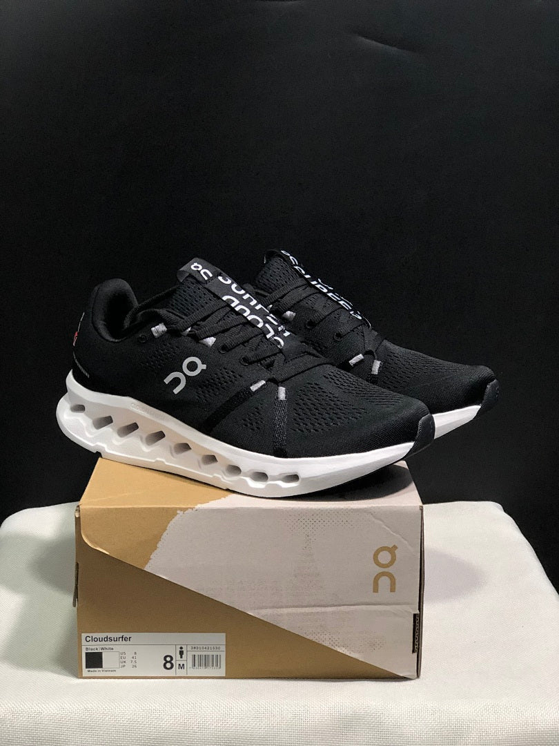 On Cloudsurfer Running Shoes in Black and White - product image from the listing.