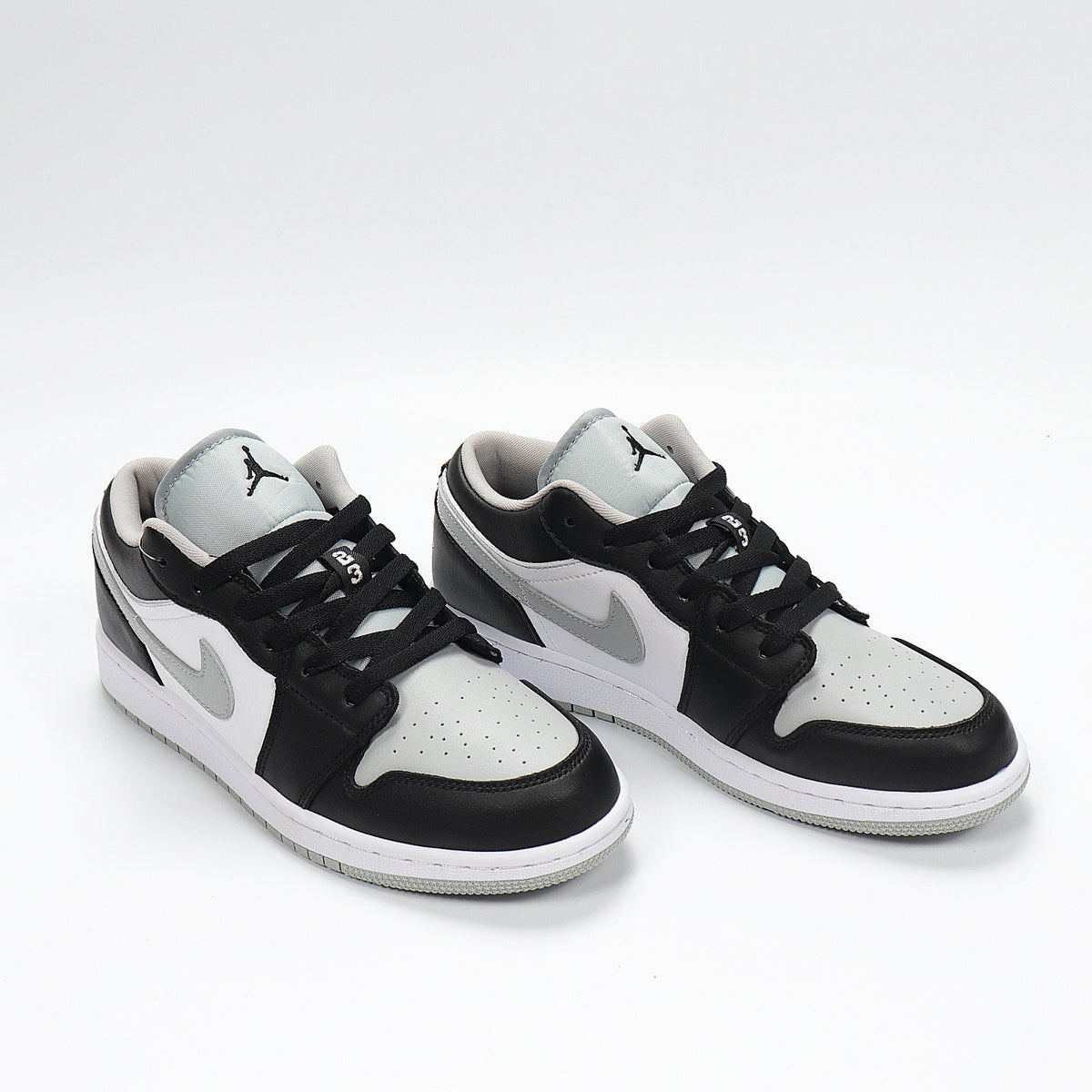 Jordan 1 Low Sneakers in Cool Grey 553560-039 - product image from the listing.