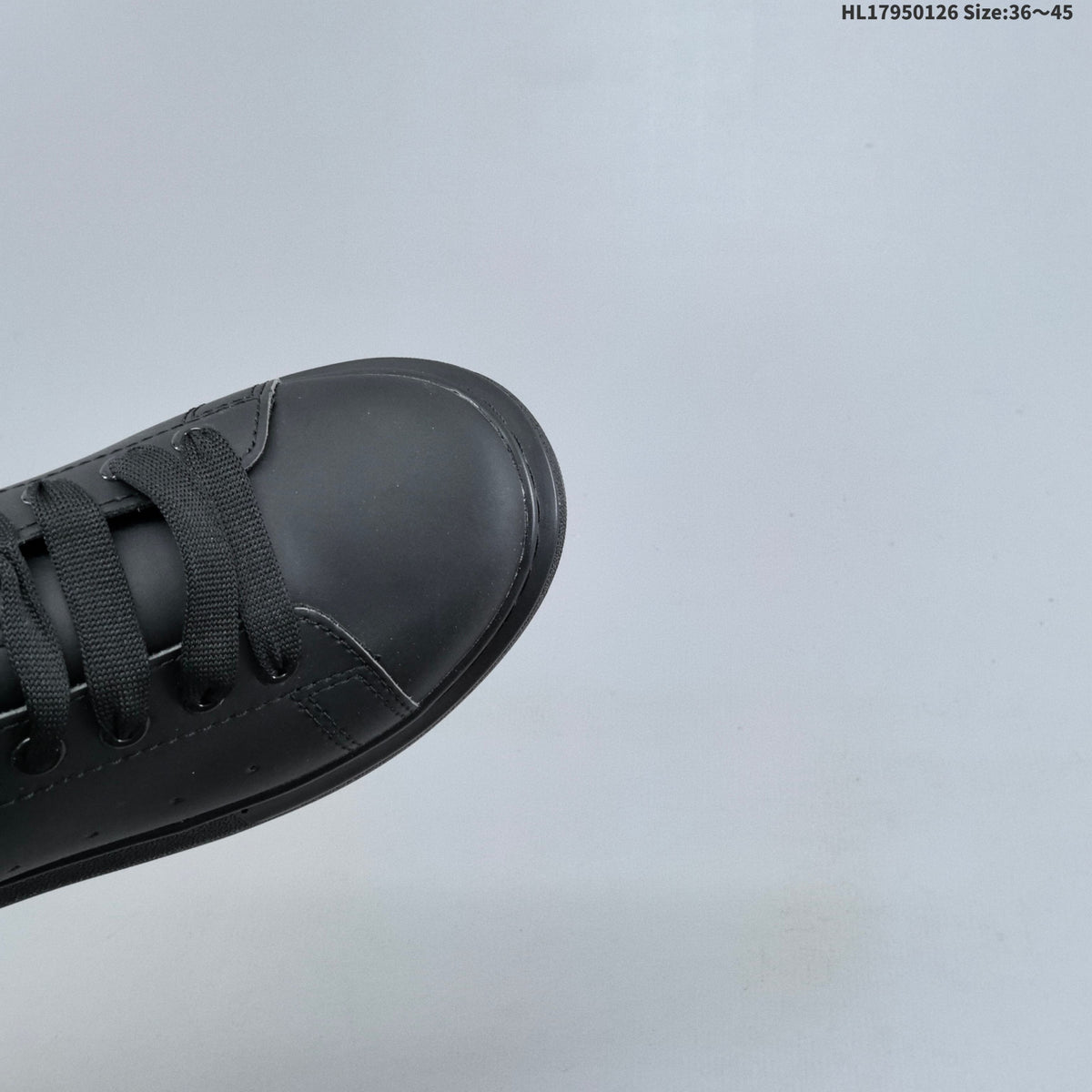 Alexander McQueen Low-Cut Sneakers in Black with Thick Sole - product image from the listing.