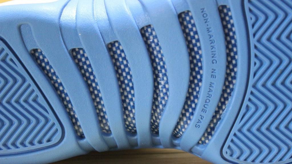 Air Jordan 12 High-Top Sneakers in University Blue 510815-127 - product image from the listing.