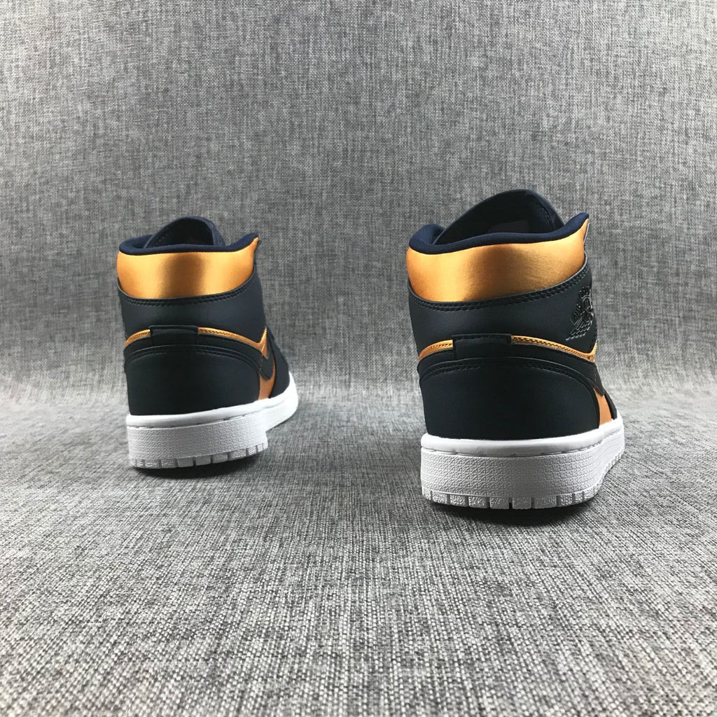 Air Jordan 1 Mid SE Sneakers in Black and Gold 852542-401 - product image from the listing.