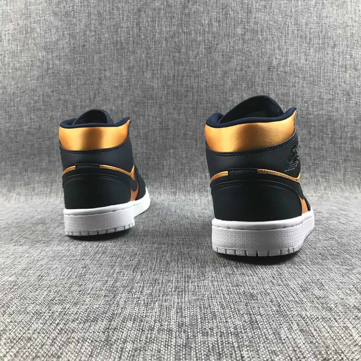 Air Jordan 1 Mid SE Sneakers in Black and Gold 852542-401 - product image from the listing.