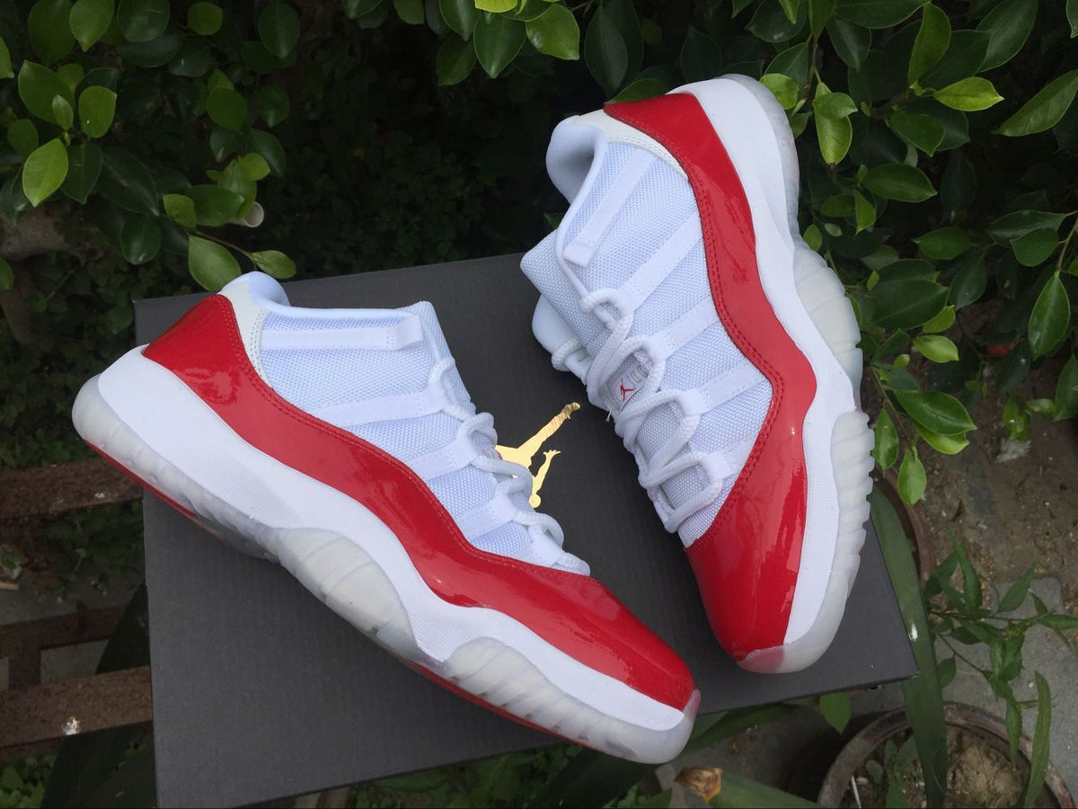 Air Jordan 11 Low Sneakers White Red - product image from the listing.