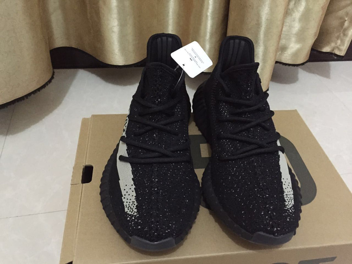 Adidas Yeezy Boost 350 V2 Sneakers in Black White - product image from the listing.