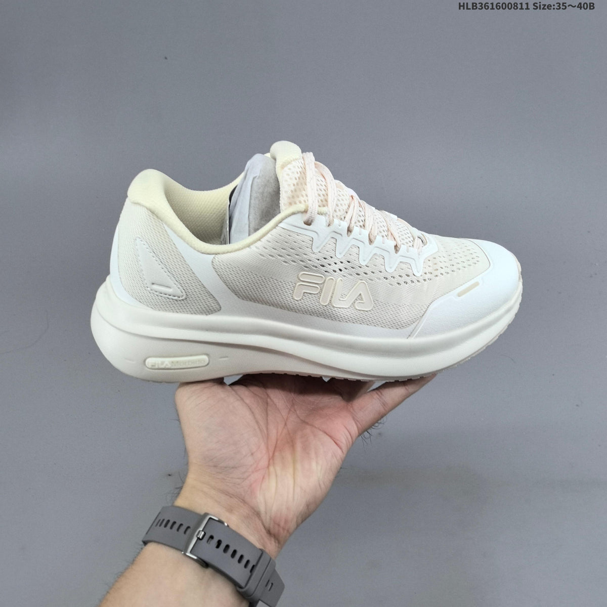 Ivory FILA Pebble Sandal Sneakers - product image from the listing.