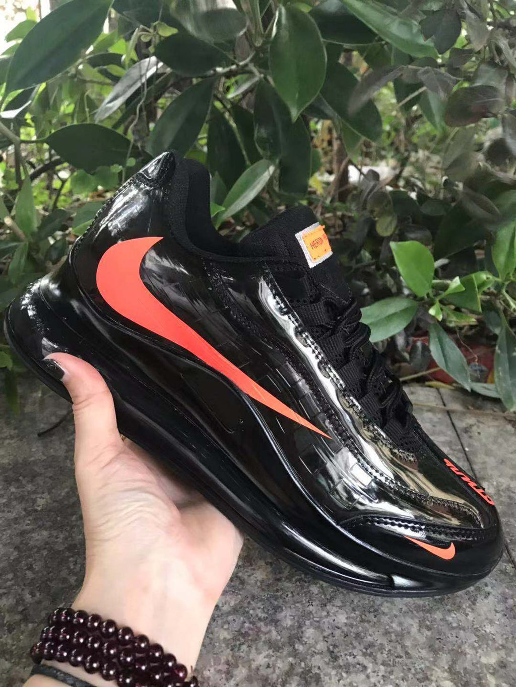 Nike Air Max 720 Sneakers in Black and Bright Orange - product image from the listing.