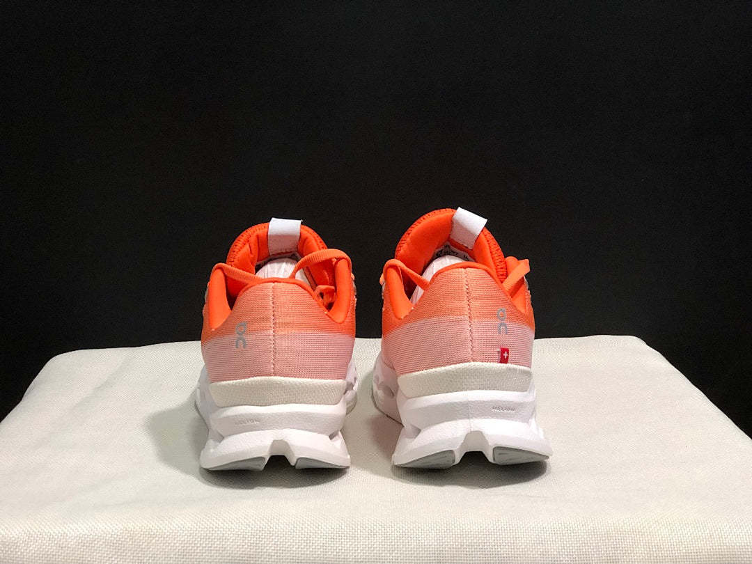 Coral and White On Cloudsurfer Running Shoes - product image from the listing.