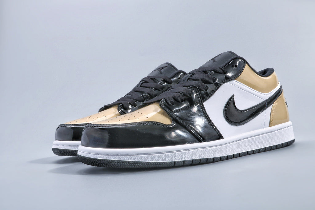 Jordan 1 Low Gold Toe Sneakers in Black and Metallic Gold - product image from the listing.
