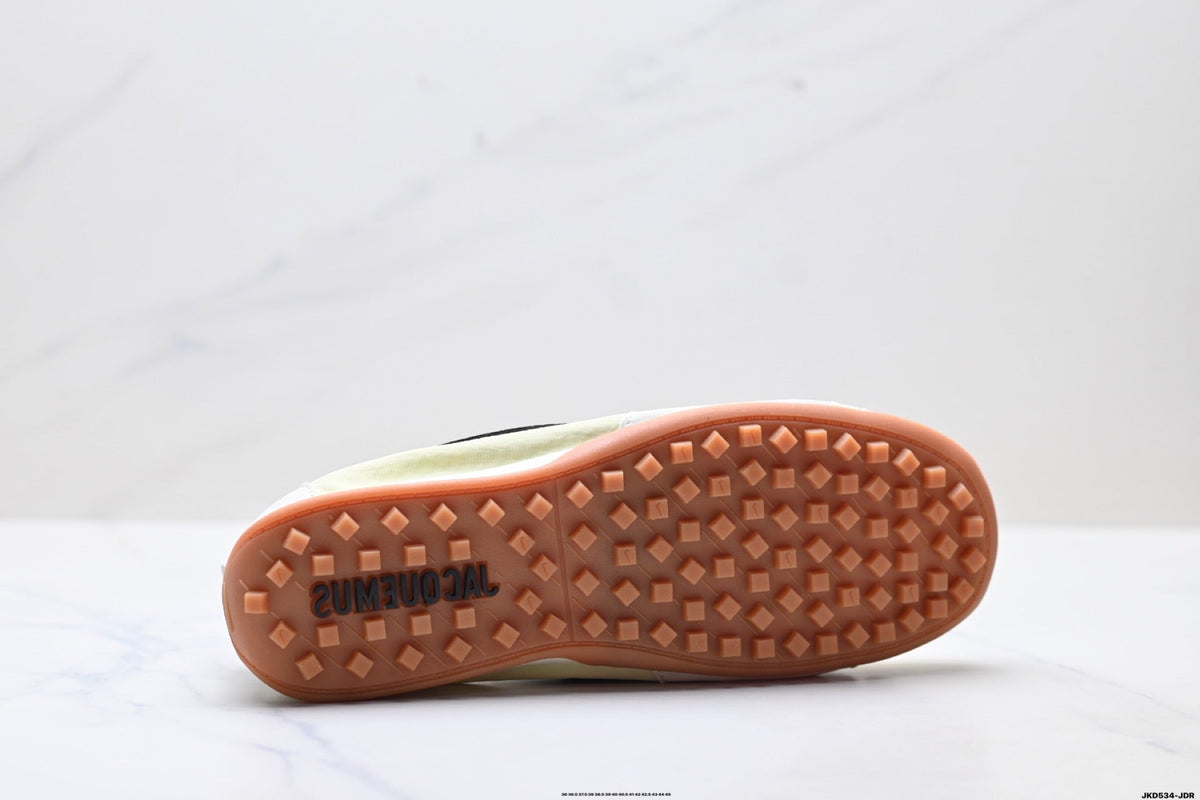 Pale Yellow and Black Nike x Jacquemus Sneakers - product image from the listing.