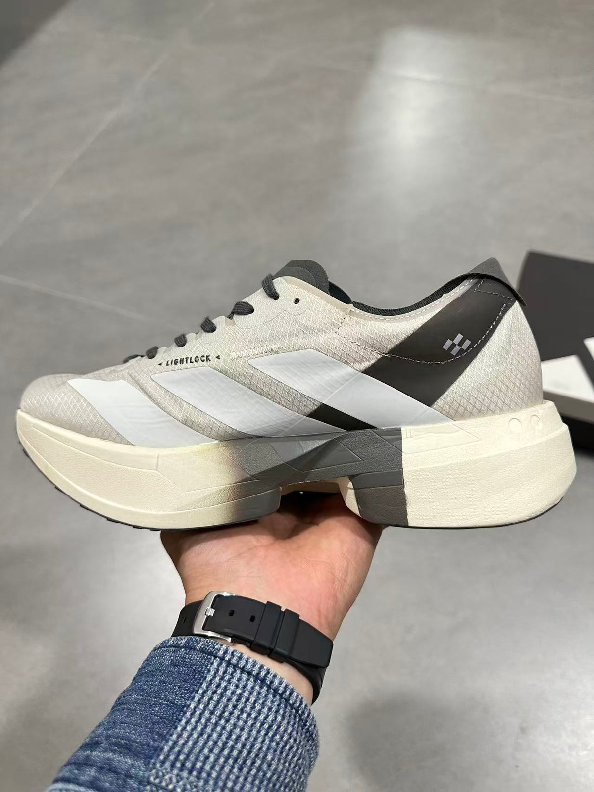 adidas Adizero Adios Pro 4 Running Shoes in White Black - product image from the listing.