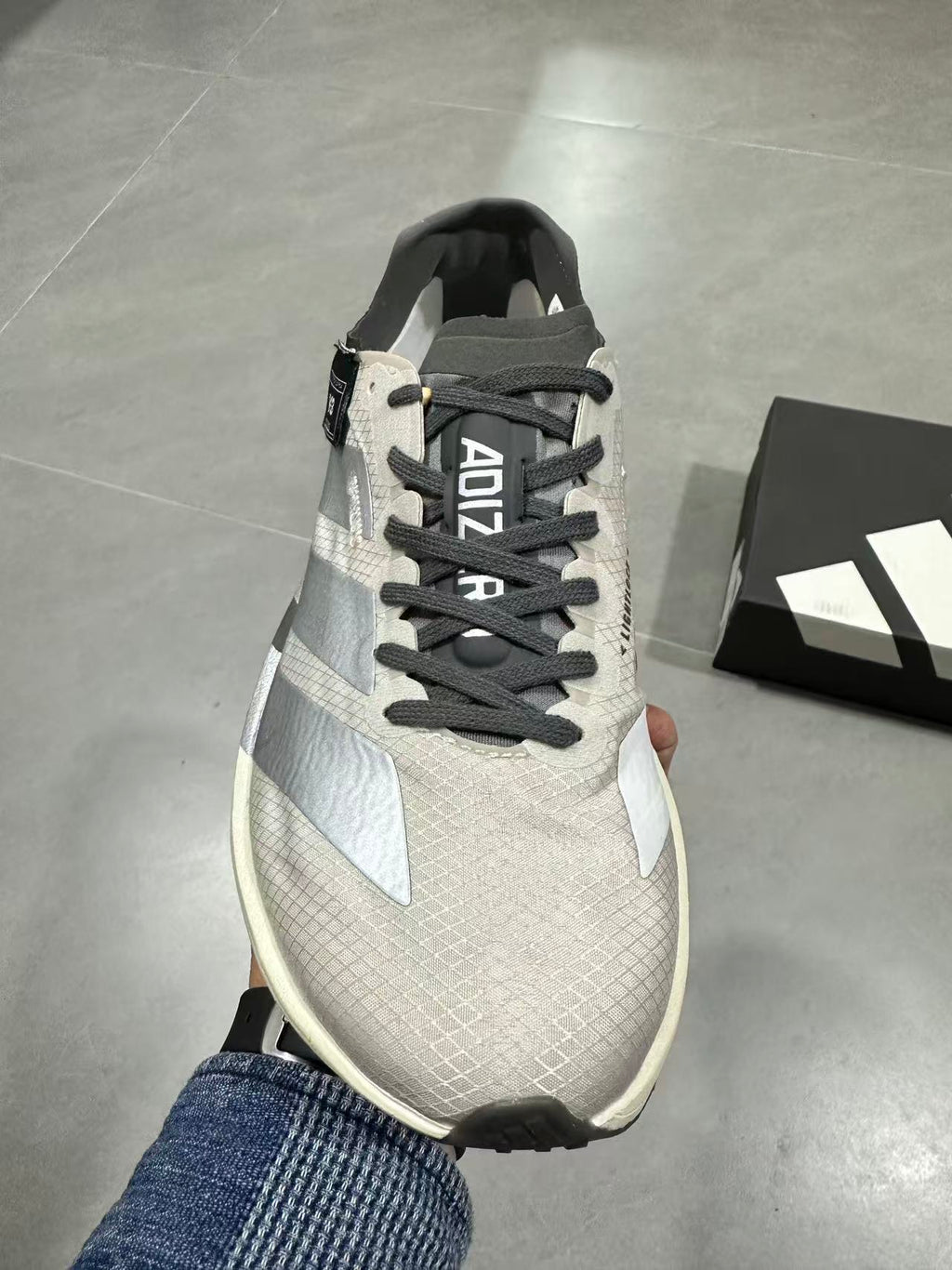 adidas Adizero Adios Pro 4 Running Shoes in White Black - product image from the listing.