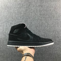 Air Jordan 1 Mid Black and White Sneakers 554724-001 - product image from the listing.