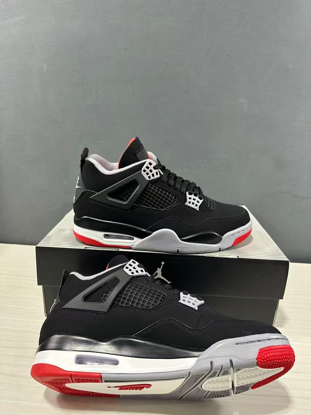 Air Jordan 4 Retro Bred Black Red Sneakers IX8180-001 - product image from the listing.