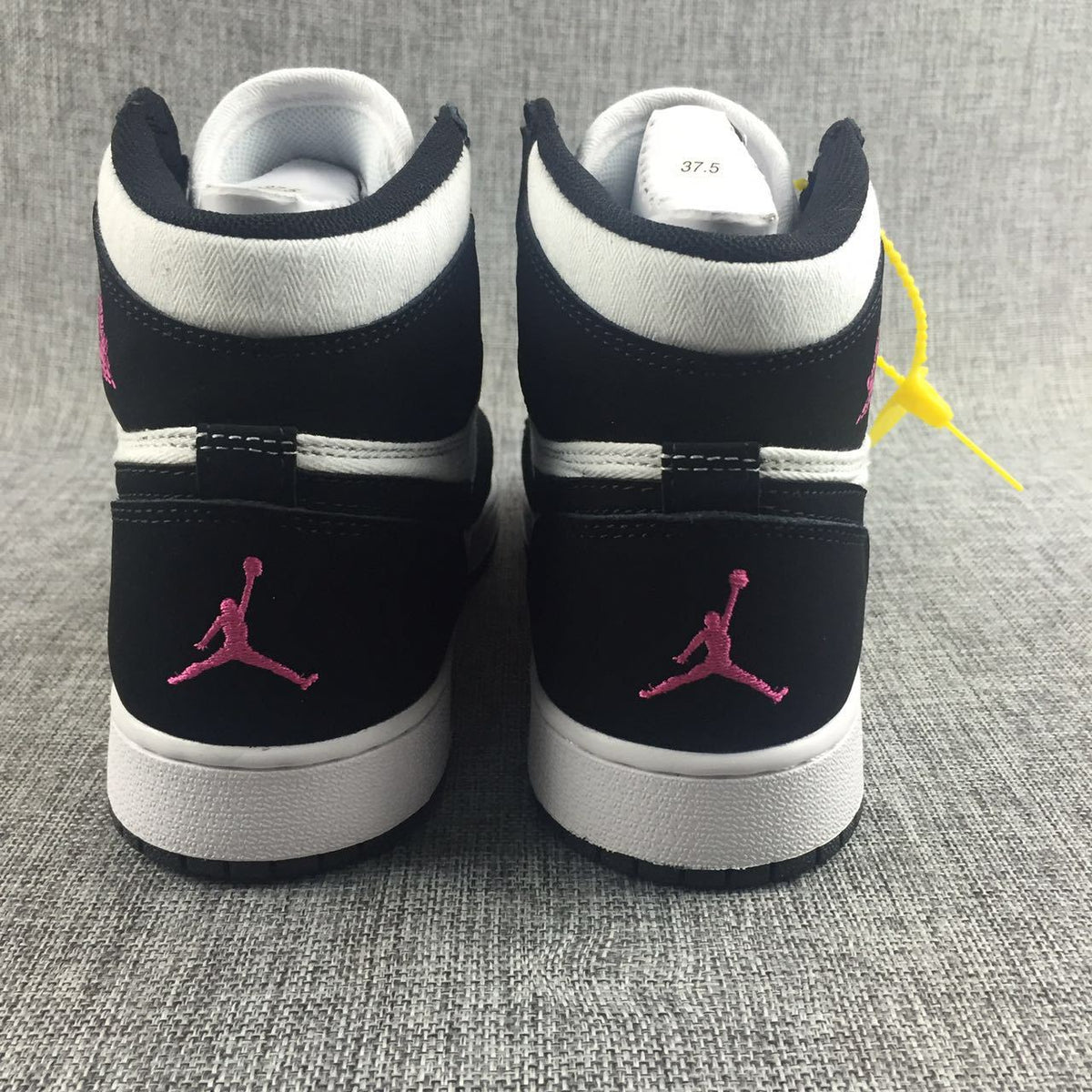 Air Jordan 1 High Black White Pink Sneakers - product image from the listing.
