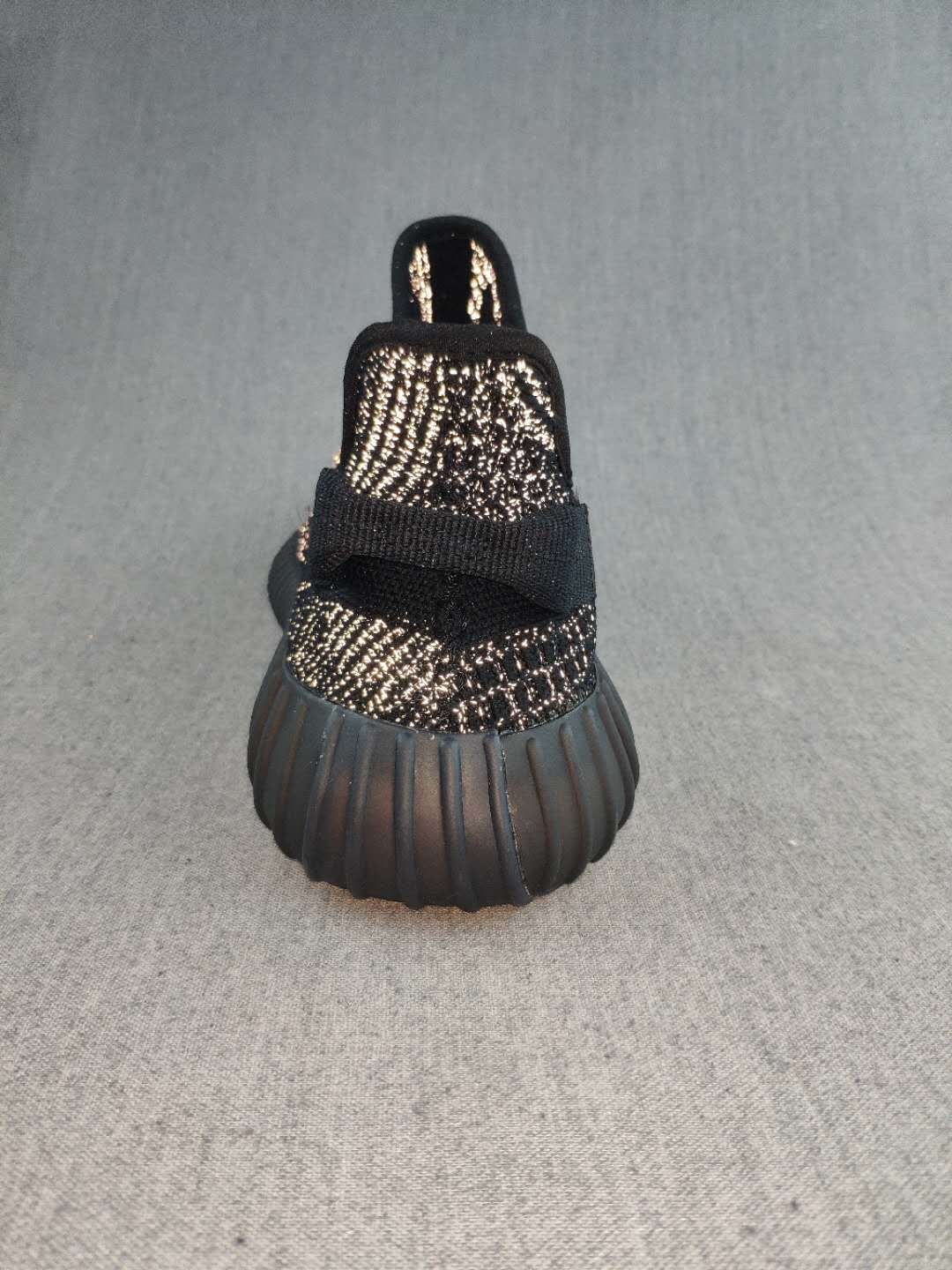 Black and Cream Yeezy 350 V2 Knit Sneakers - product image from the listing.