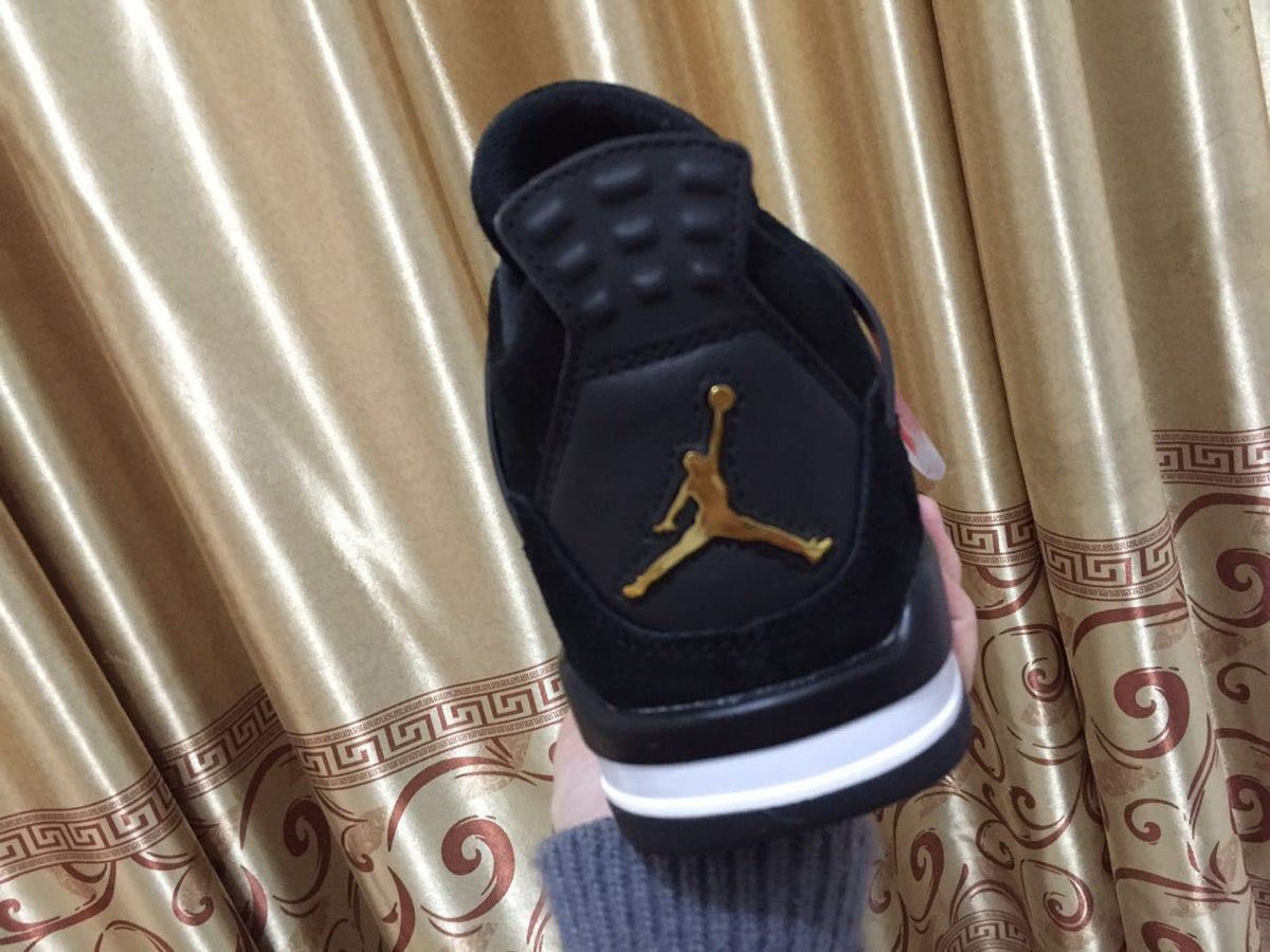 Jordan 4 High-Top Sneakers in Black and Gold - product image from the listing.