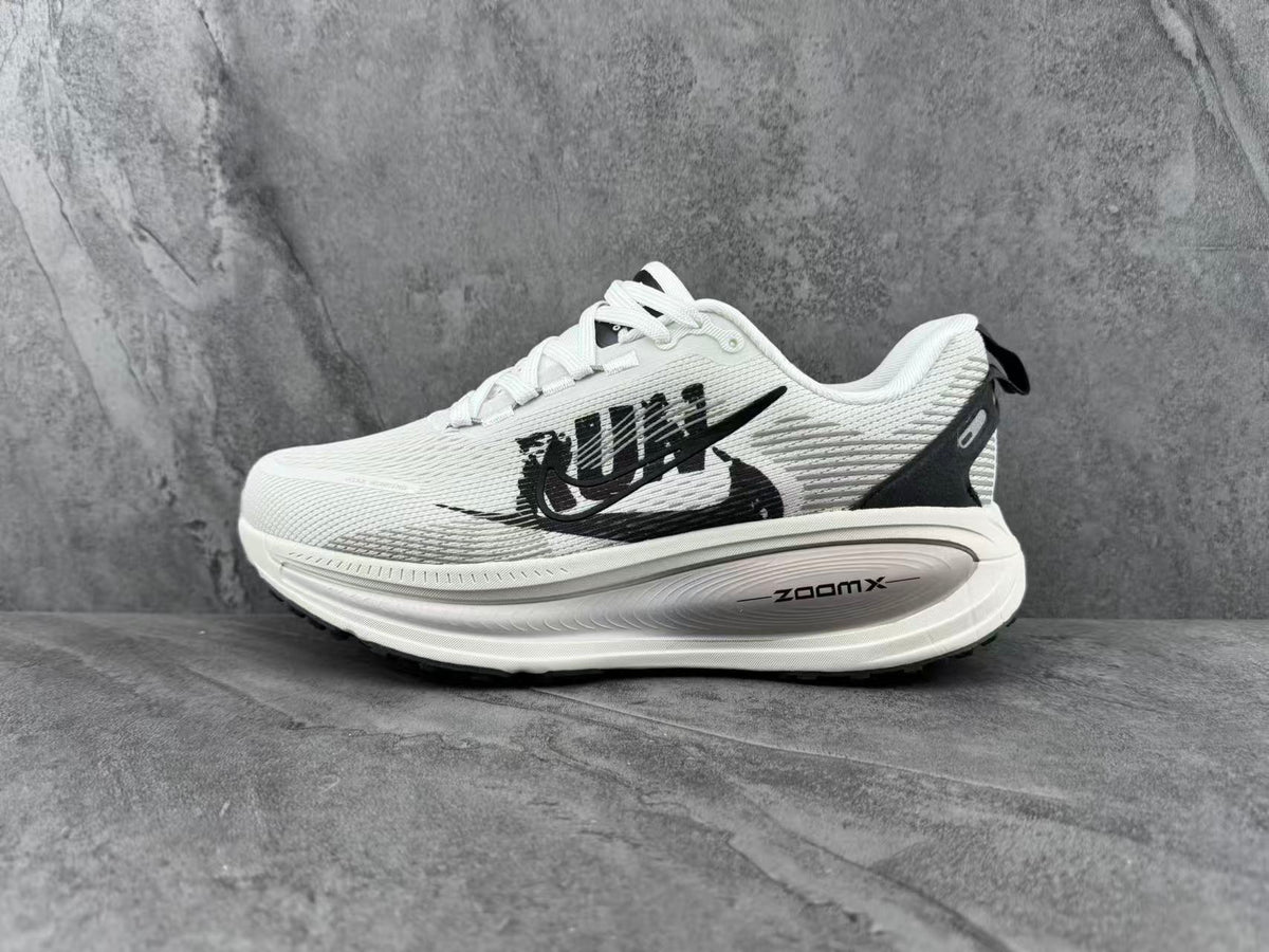 Nike ZoomX Running Sneakers in White and Black - product image from the listing.