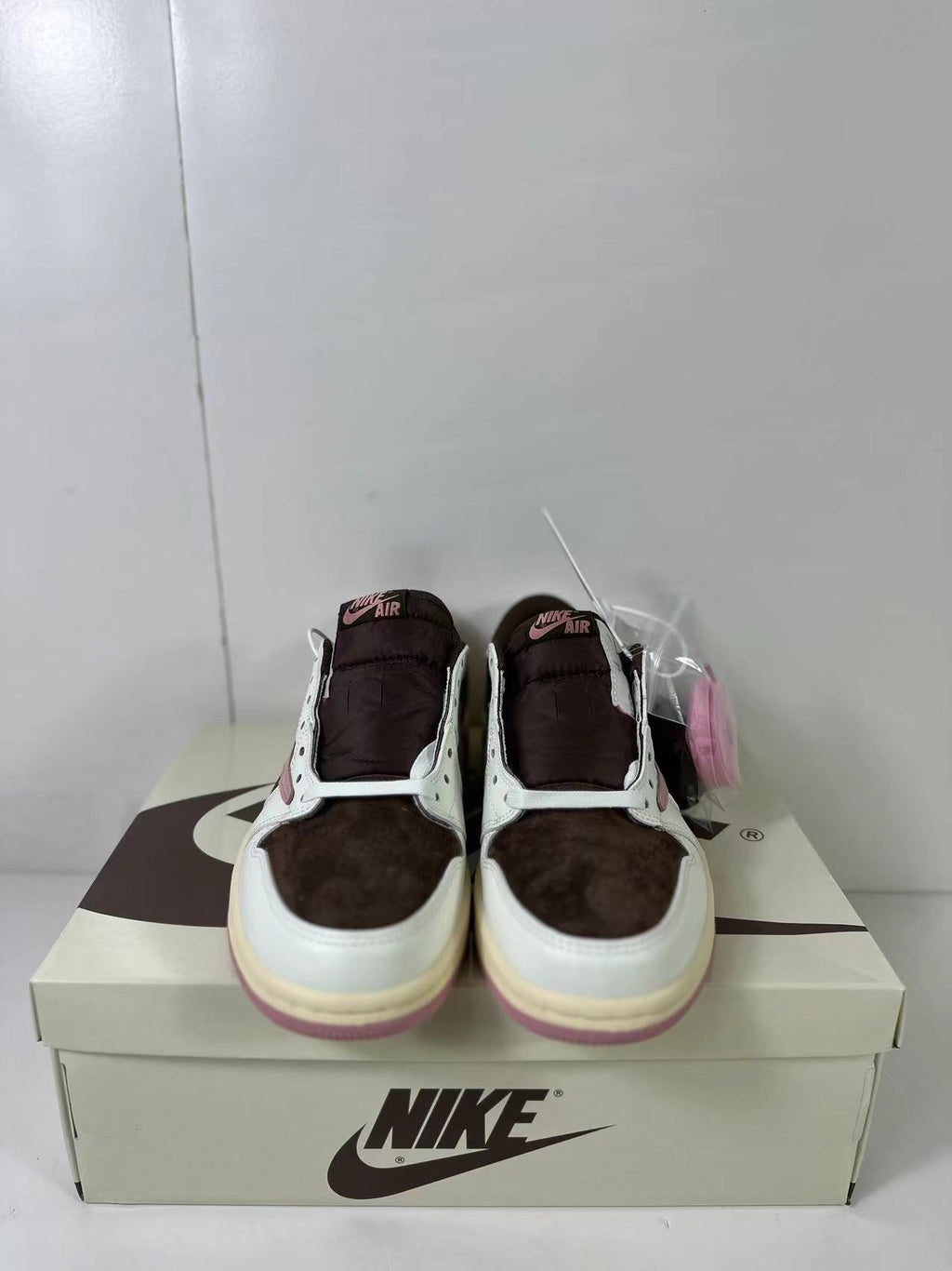 Jordan 1 Low Travis Scott in Brown White Pink DZ4137-206 - product image from the listing.