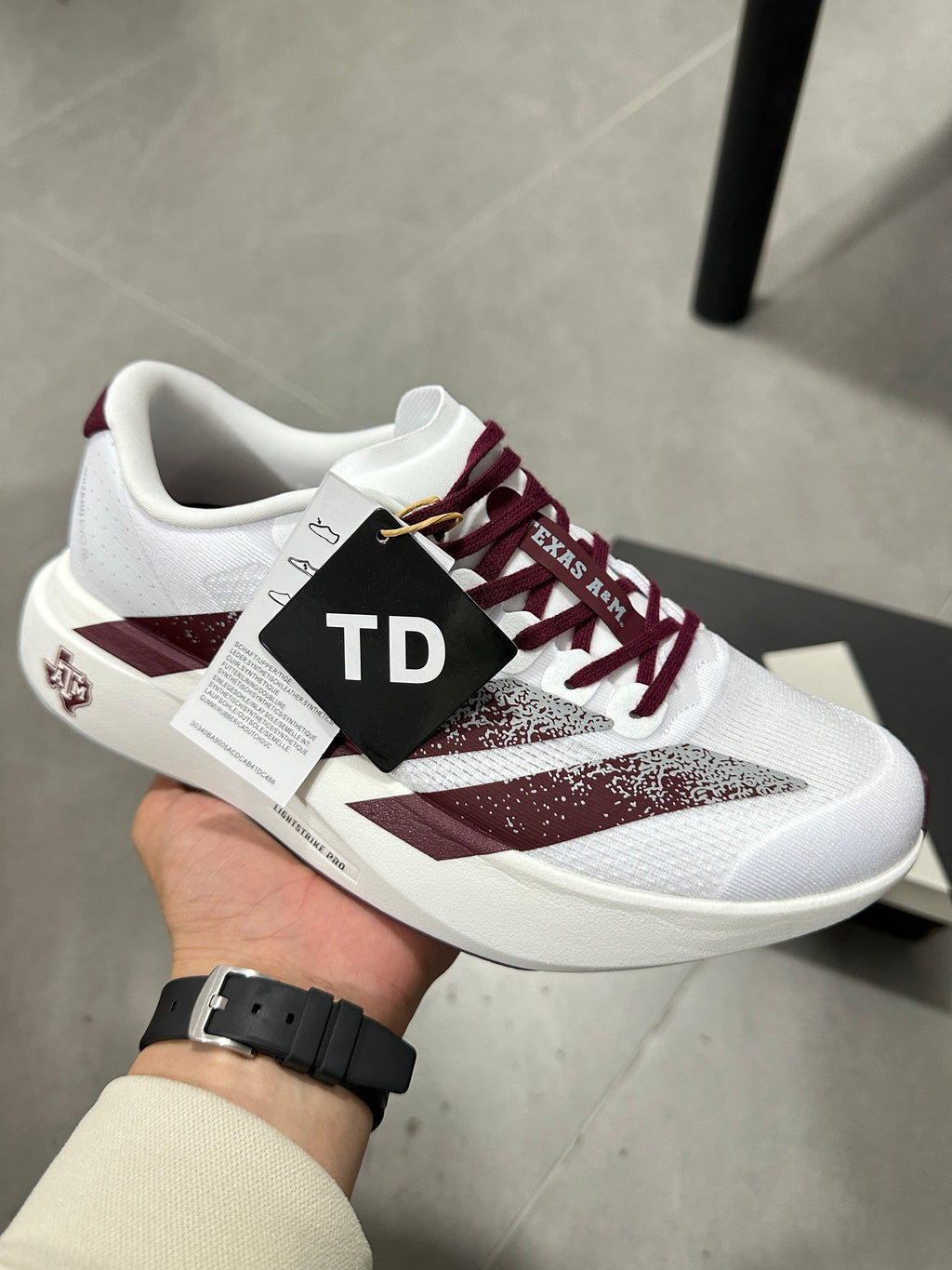 Adidas Lightstrike Pro Running Shoes in White Burgundy JQ4566 - product image from the listing.