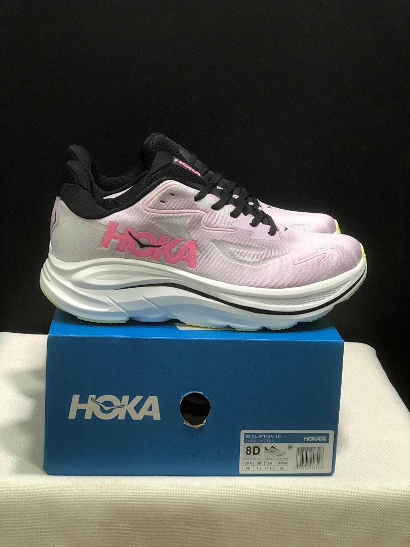 Pink and White HOKA Clifton 10 Running Shoes - product image from the listing.