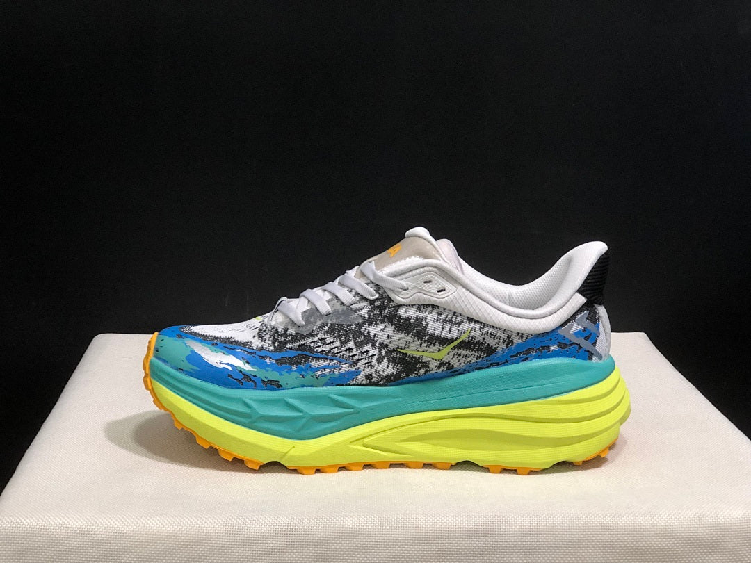 Blue and Lime HOKA Stinson 7 Trail Sneakers - product image from the listing.