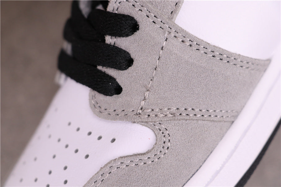 Air Jordan 1 High Sneakers in Light Smoke Grey 555088-126 - product image from the listing.