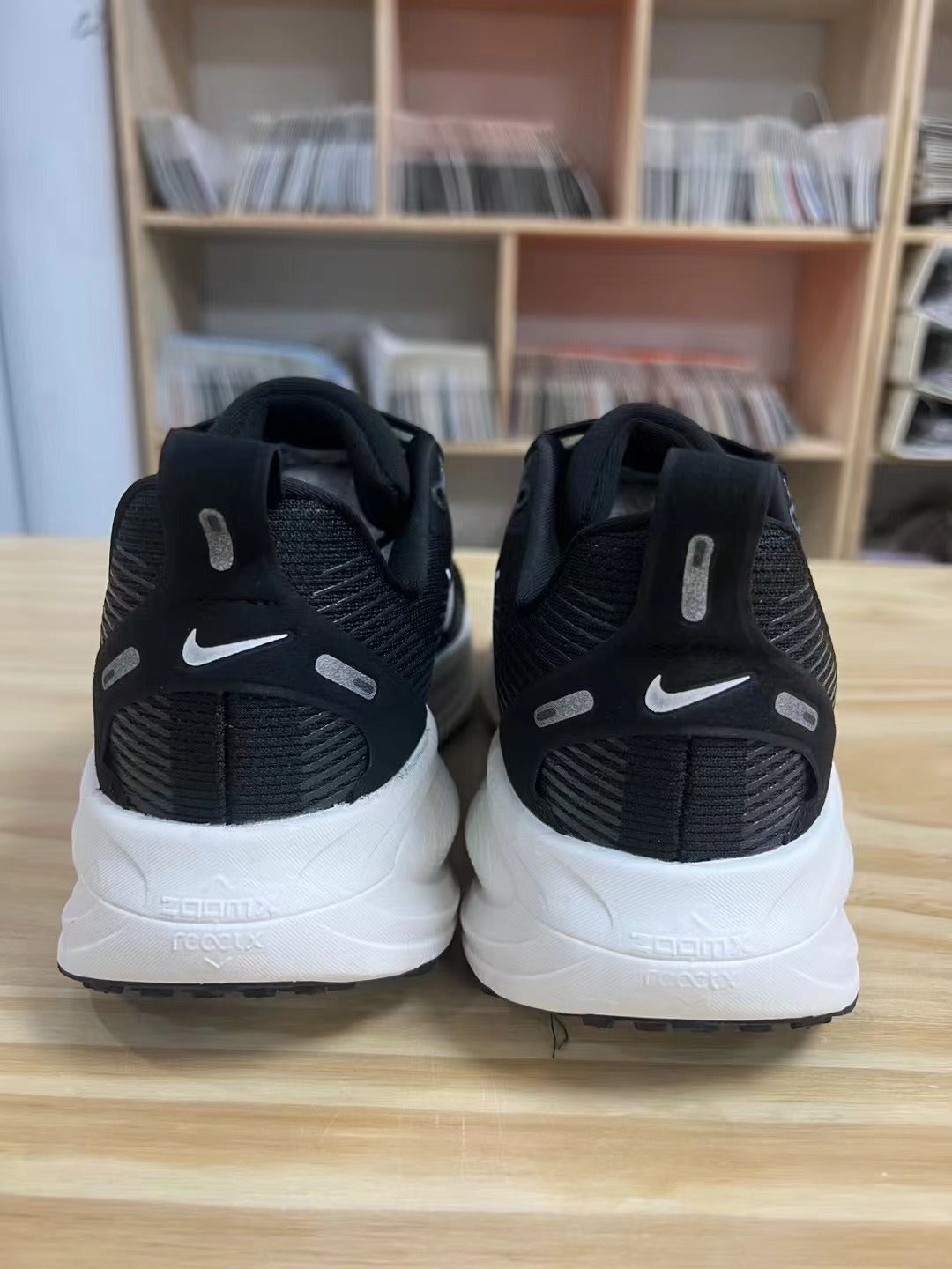 Nike Vomero 18 Running Shoes in Black and White - product image from the listing.