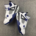Air Jordan 4 Sneakers in White, Black and Blue - product image from the listing.