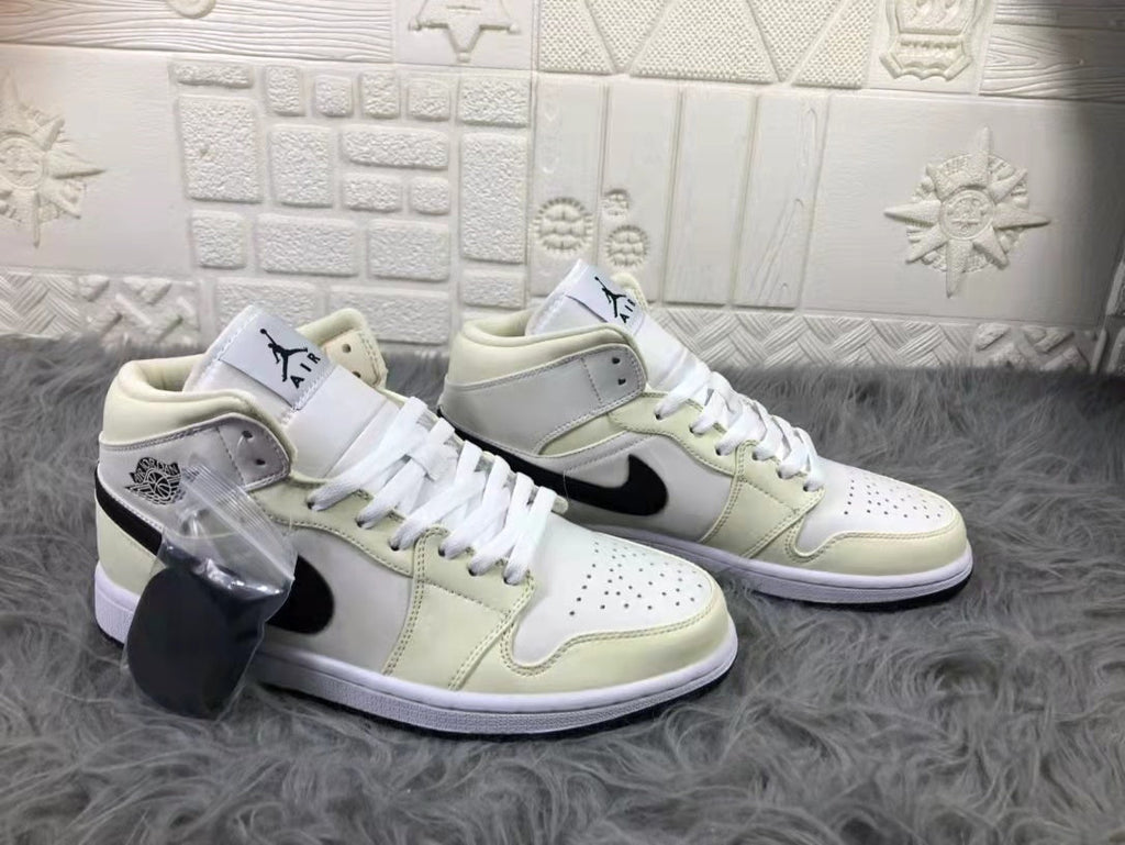 Jordan Air 1 Mid Sneakers in Cream White and Black - product image from the listing.