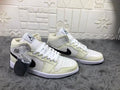 Jordan Air 1 Mid Sneakers in Cream White and Black - product image from the listing.