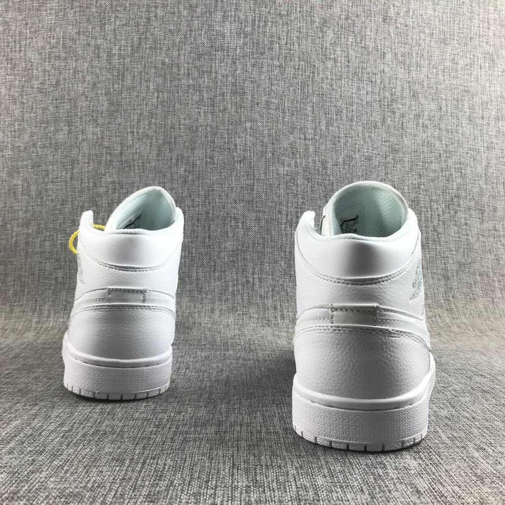 Air Jordan 1 Mid Sneakers in White - product image from the listing.