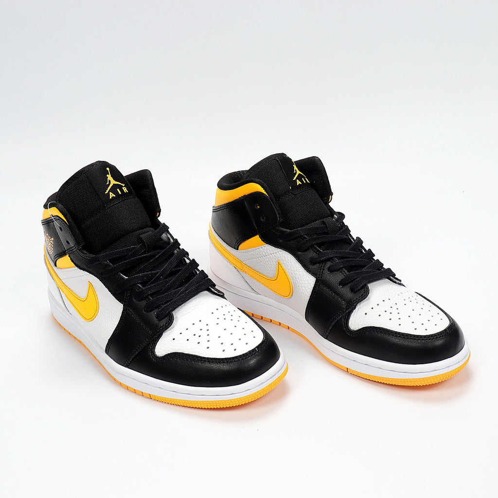 Jordan 1 High Sneakers in Black Yellow White CV5276-107 - product image from the listing.
