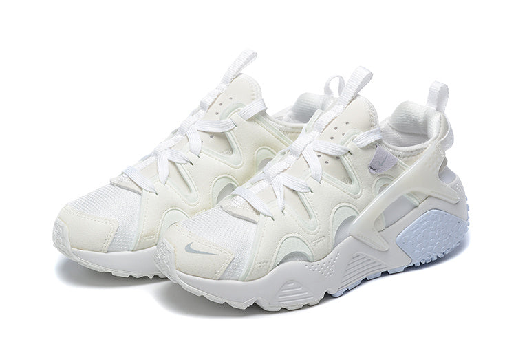 White and Pale Blue Nike Air Huarache Run Sneakers - product image from the listing.