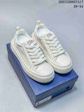 Dior Low-Top Sneakers in White and Navy 2607GDD607A17 - product image from the listing.