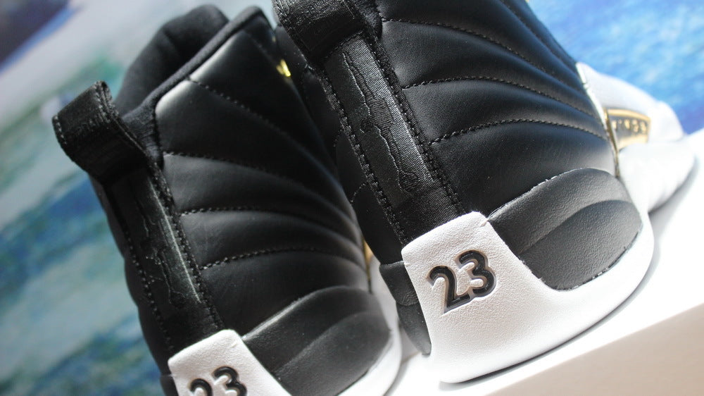 Air Jordan 12 Wings Black White Gold Sneakers 848692-033 - product image from the listing.