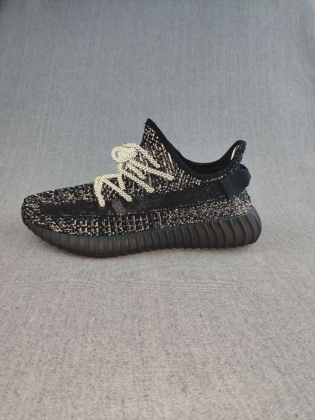 Black and Cream Yeezy 350 V2 Knit Sneakers - product image from the listing.
